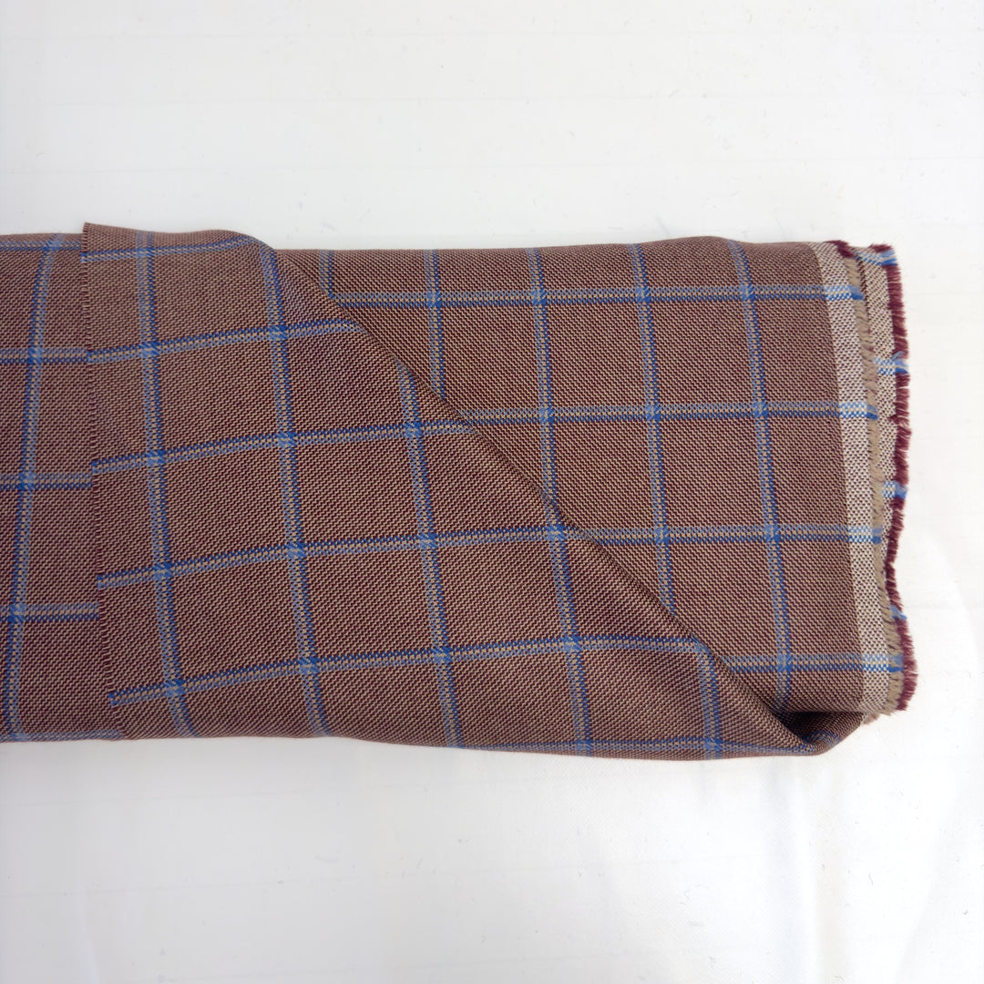 Reddish-brown pure wool check fabric with blue and light blue lines, on the bolt, on a white background
