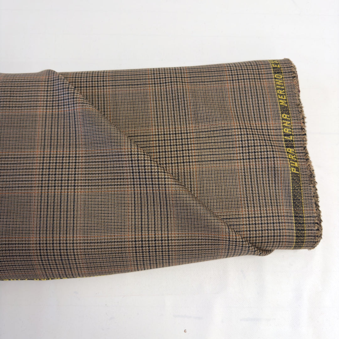 Pièce de tissu à carreaux marron avec la lisière « PURA LANA MERINO EXTRA FINE »