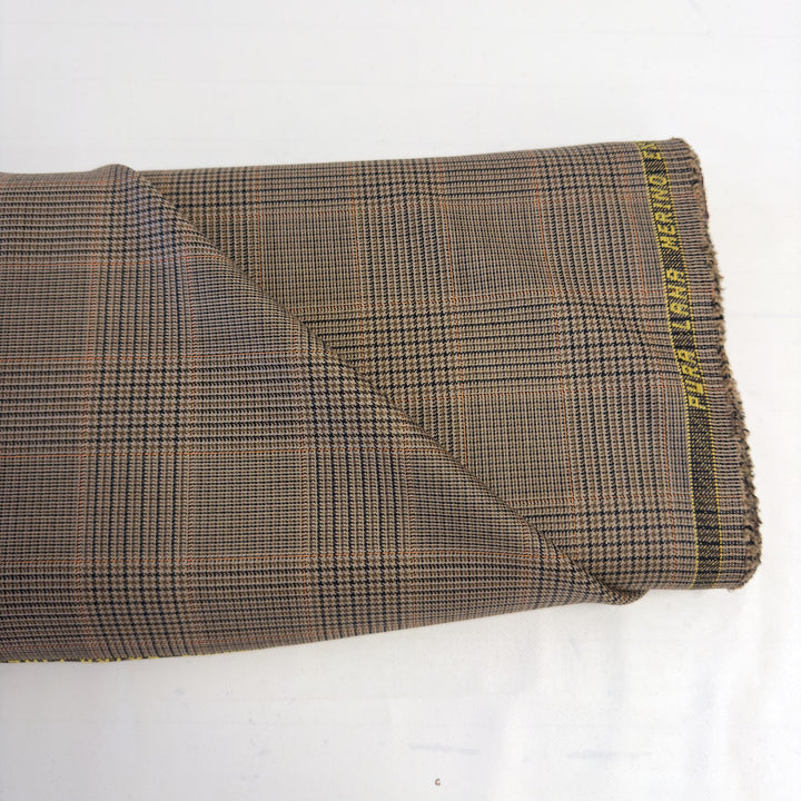 Pièce de tissu à carreaux marron avec la lisière « PURA LANA MERINO EXTRA FINE »