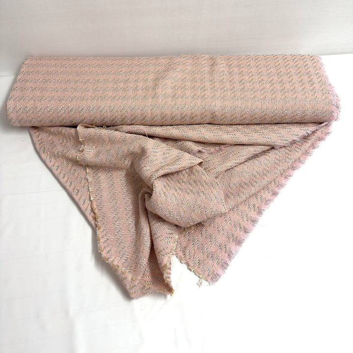 Roll of 160 cm wide pink fabric, with the fabric draped in front of it