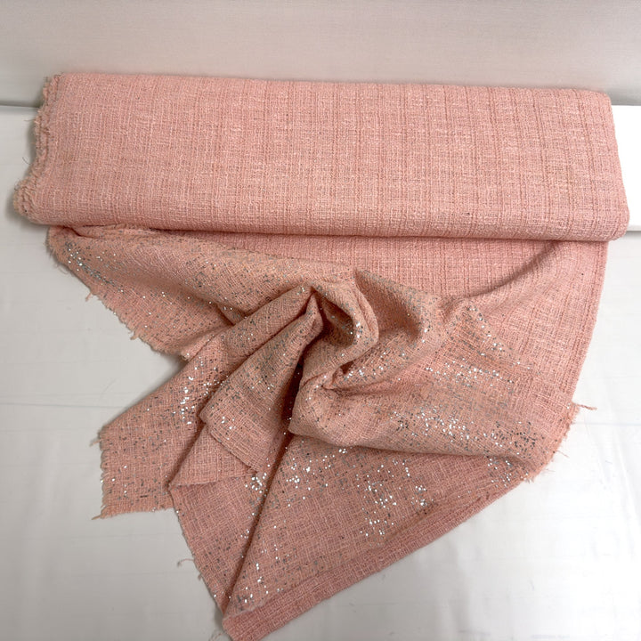 Pink sequin fabric, draped to show its softness and shimmer